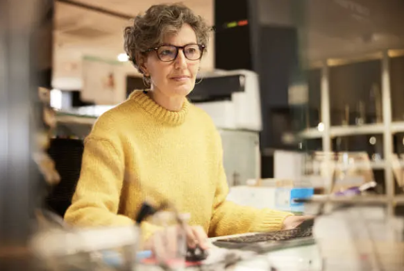A woman working at her desk.